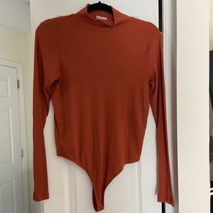 Rust Orange Turtleneck Bodysuit